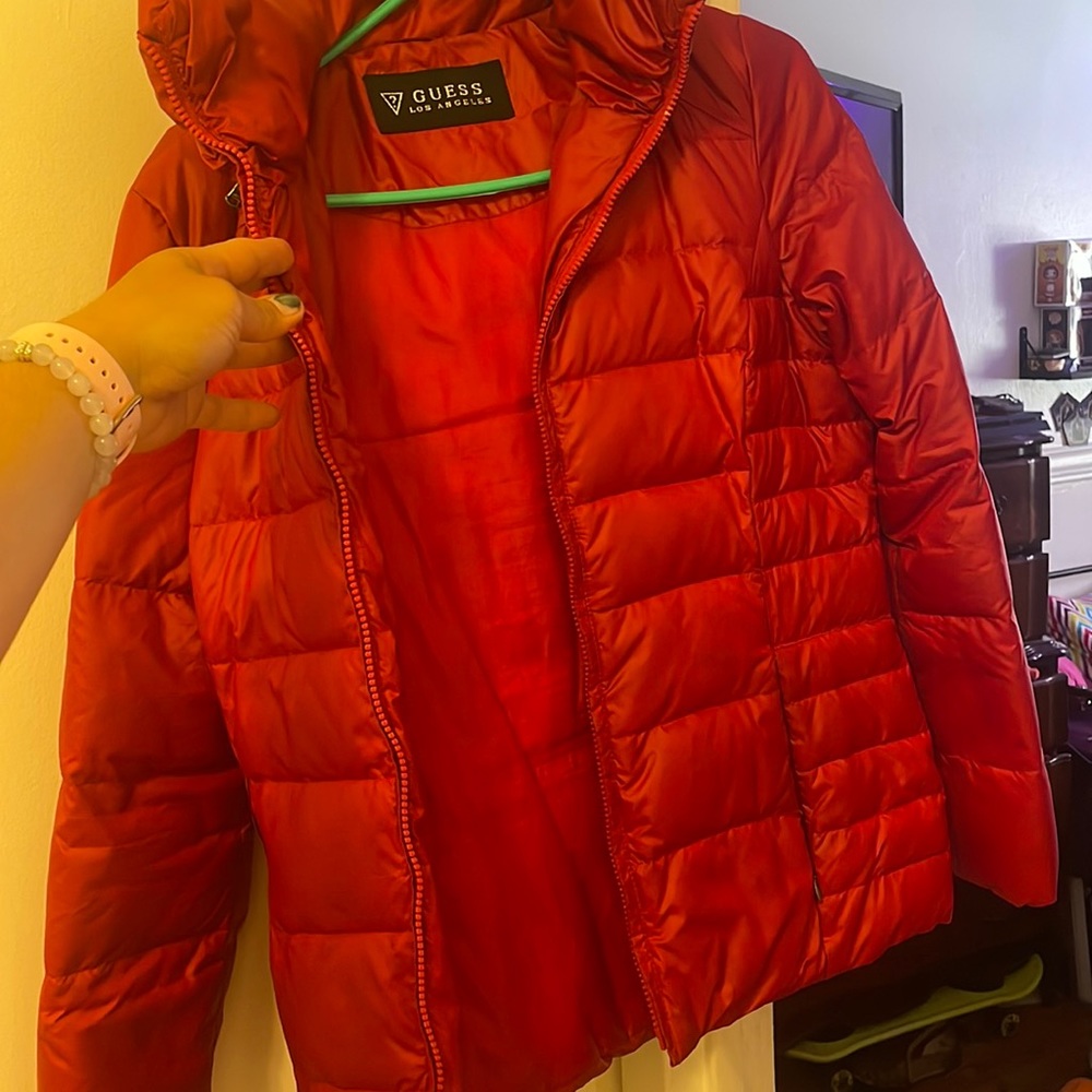 Red puffer jacket washed before not as fluffy  good condition belt is included